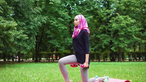 muslim woman exercising outdoors in a park