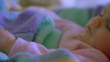 close-up of cute caucasian baby relaxing on baby bed in a comfortable home 4k