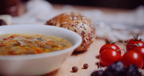 Soup-In-Bowl-Amidst-Various-Ingredients-Assorted-On-Wooden-Table-8