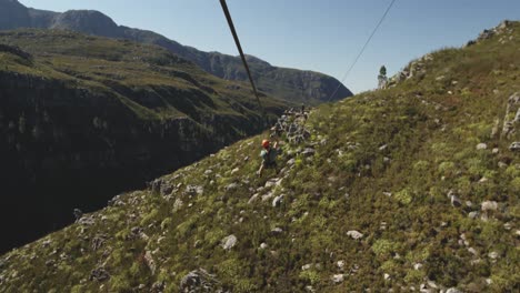 young caucasian man zip lining