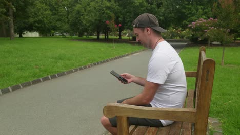 relaxed moments on a bench, scrolling on the phone, enjoying leisure time