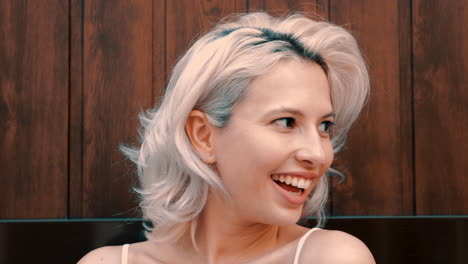 smiling woman with blonde short hair