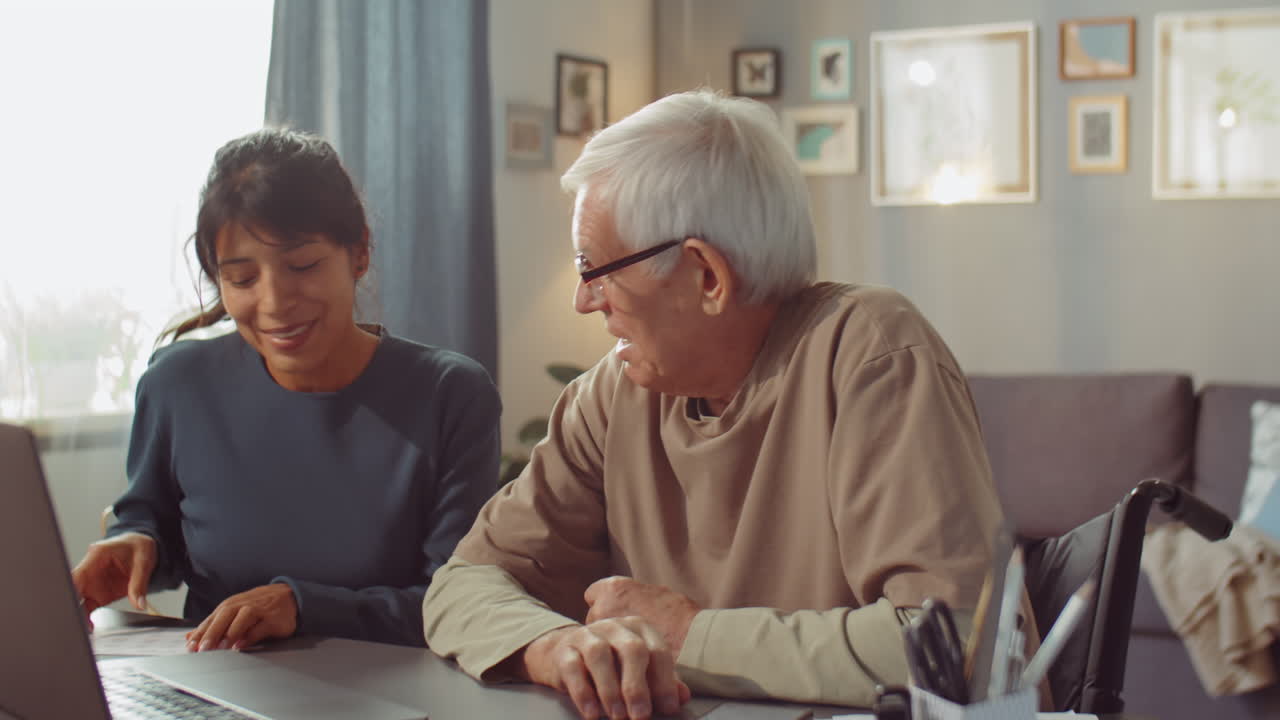 Volunteer Explaining Something To Man