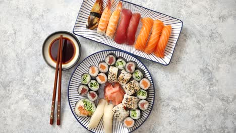 Asian-food-assortment--Various-sushi-rolls-placed-on-ceramic-plates