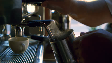 chef filling coffee mug from machine 4k