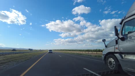 Truck-Driving-down-Busy-Highway