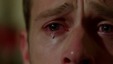close-up of a man crying with tears