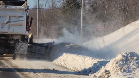 Truck-With-Attached-Snowplow-On-The-Side-Clearing-Snow-On-The-Road-In-Ontario,-Canada