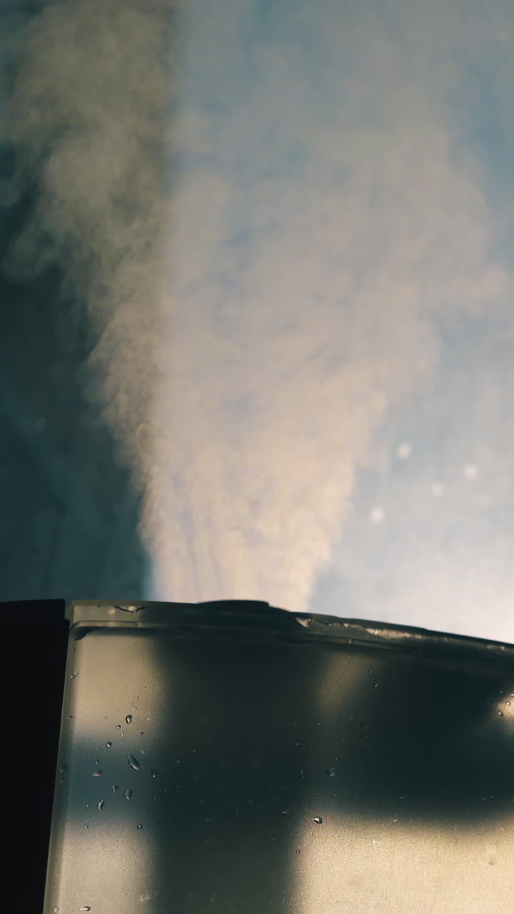 CU: plastic transparent air ionizer emits wet steam for humidification atmosphere and neutralize bacteria in room close view