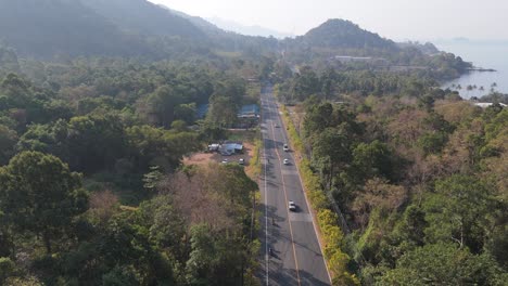 aerial drone footage of white sand beach village, koh chang, thailand. capturing sunny morning views of the coast and tropical scenery