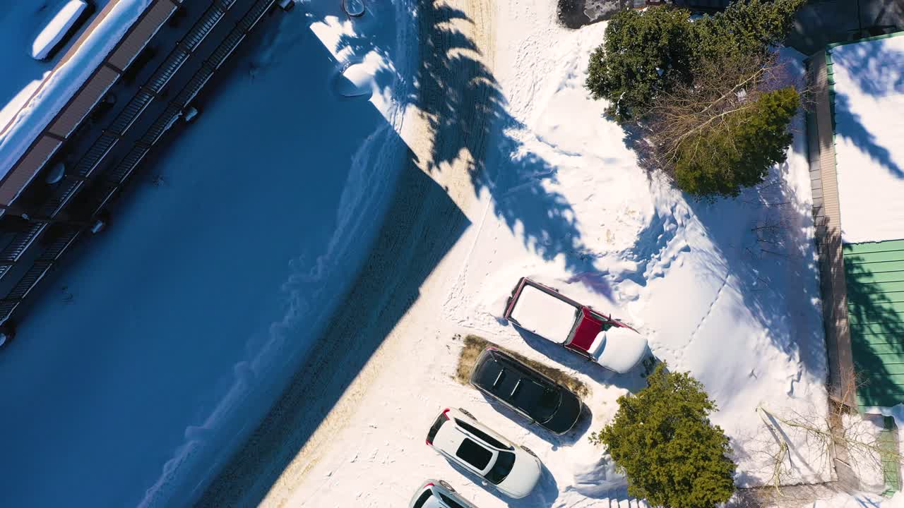 Top Down Drone View of Winter Neighborhood Houses Covered in Snow in Breckenridge Colorado Mountain Town Cul-de-sac With Rustic Vacation Homes, Aerial Bird's Eye View in Pine Tree Forest
