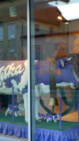 milka cow display in a shop window