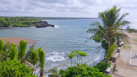 seascape rising drone view over clifftop of boca de yuma rugged coastline on a windy day, dominican republic