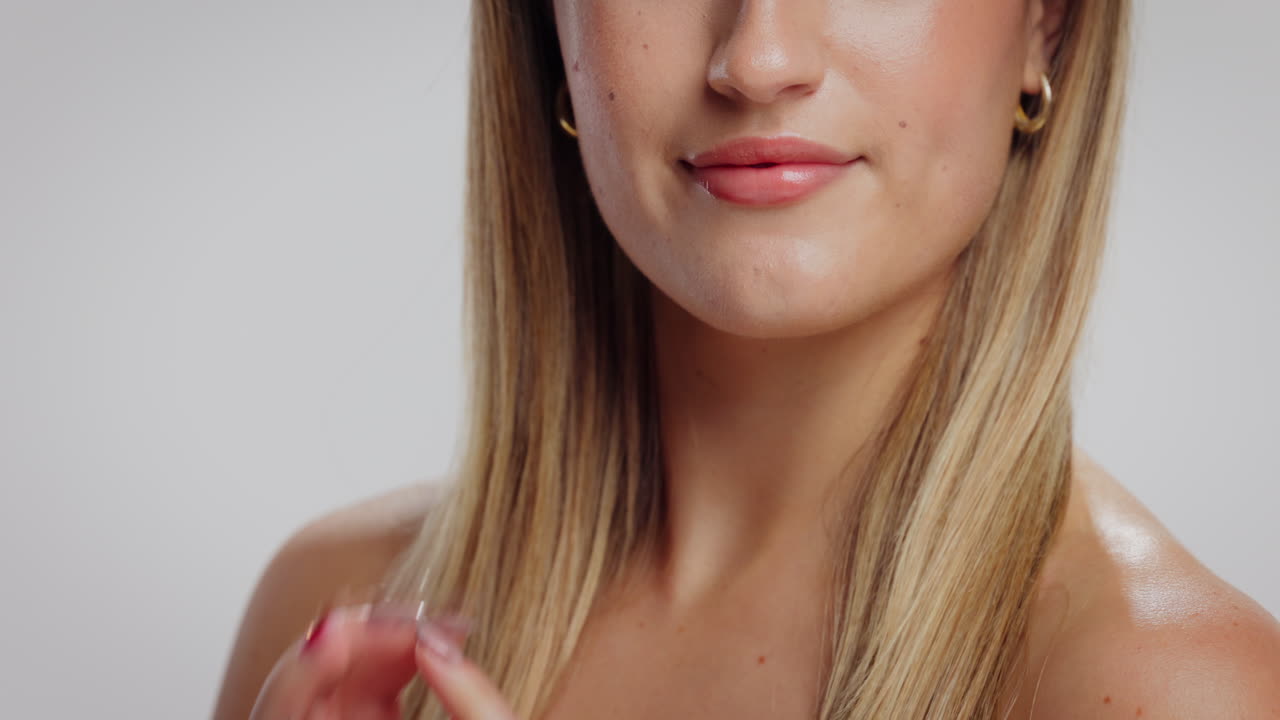 Close-up of a woman's face and hands