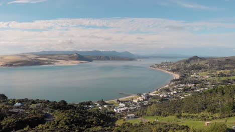 200%-SPEED-drone-upward-motion-view-of-Omapere,-New-Zealand