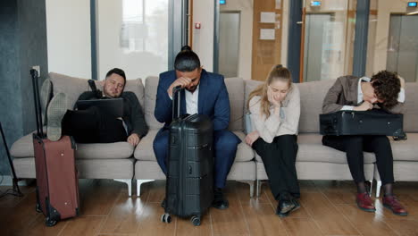 tired business travelers waiting