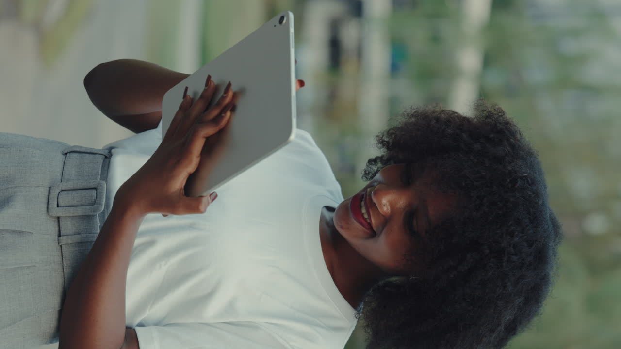 Woman using a tablet outdoors