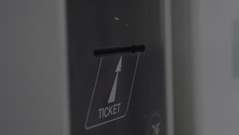 taking ticket from self-service machine