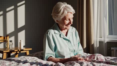 elderly woman drinking water in bed