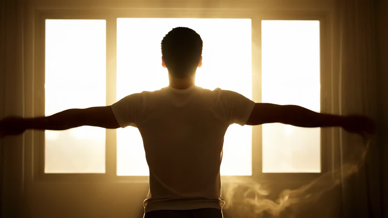 Man stretching in front of a window at sunrise