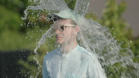 man gets water poured on his head