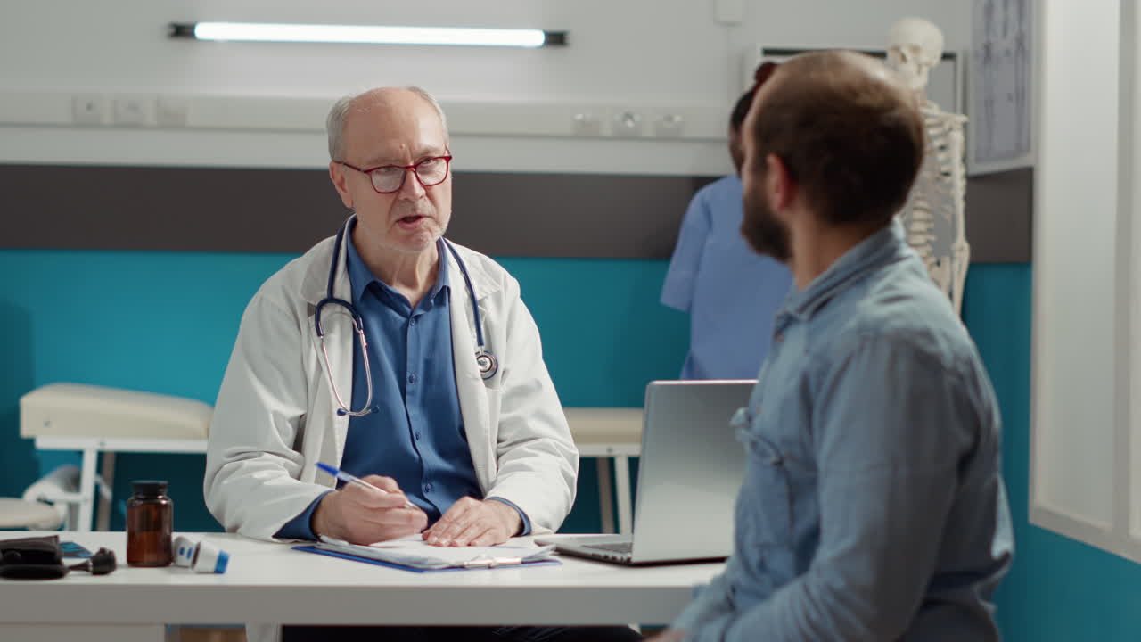 General practitioner taking notes on medical documents