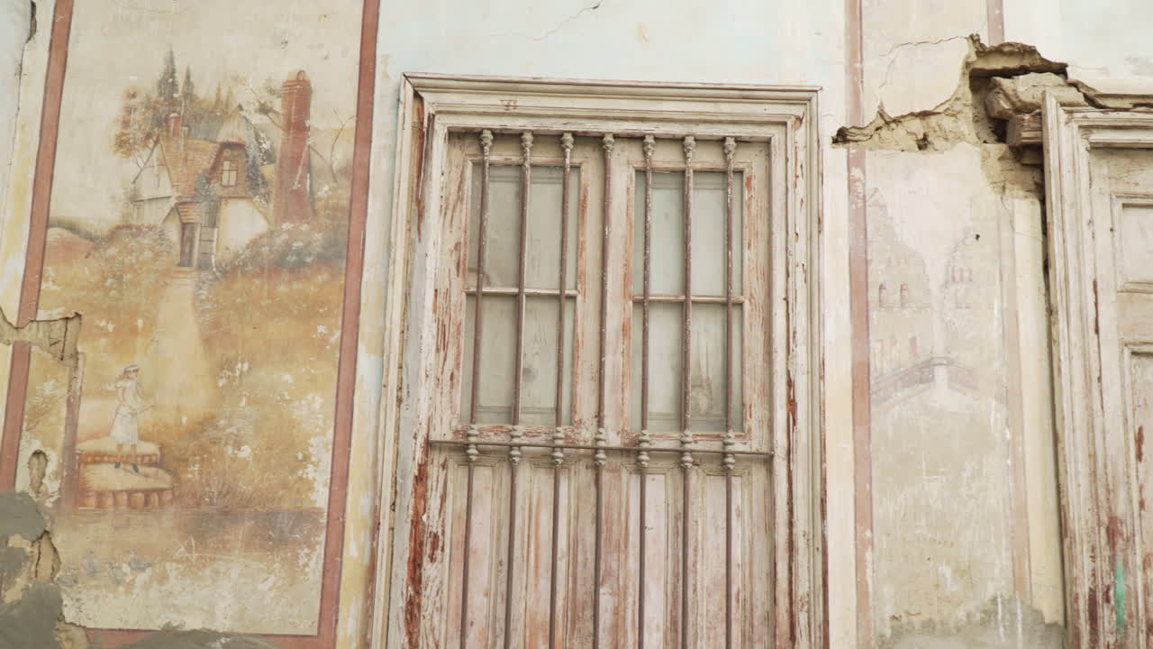 Architectural features of the old buildings on Ascope, La Libertad, Peru. Ornament and pictures on old house in Peru.