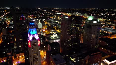 night cityscape aerial shot of leveque tower, ohio statehouse and supreme court - columbus, ohio