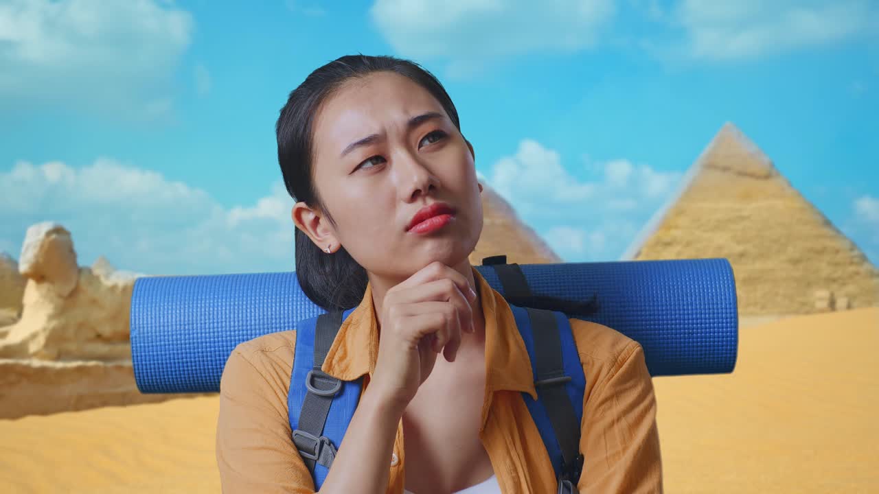 Close Up Of Asian Female Hiker With Mountaineering Backpack Thinking About Something And Looking Around While Traveling In Pyramid Of Giza
