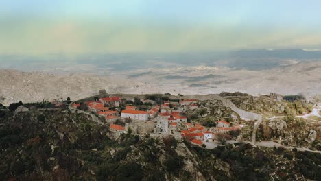 mountainous medieval historical city inside castle walls, dolly out aerial