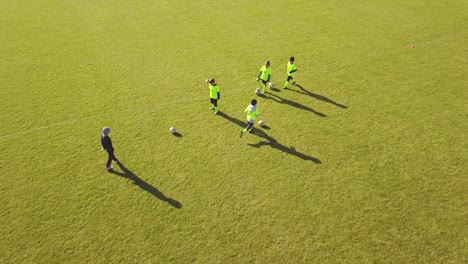 young soccer players training on a field