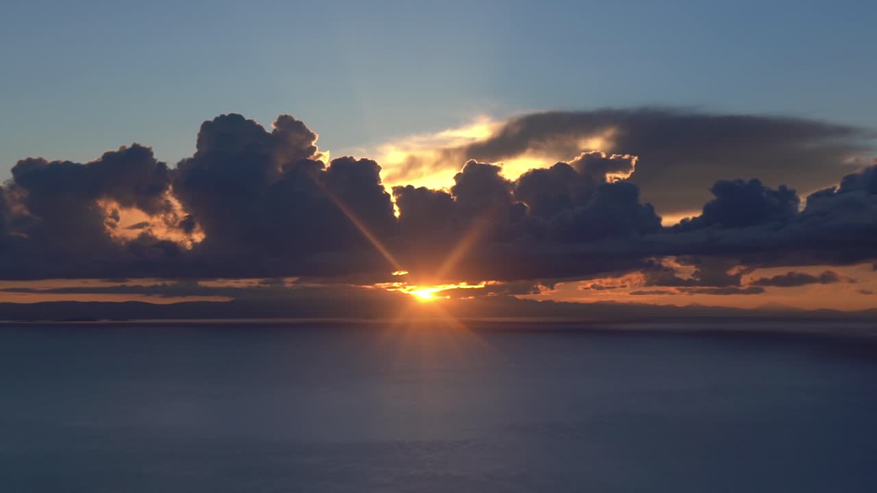 Fiery sunset over Lake Titicaca, Amantani Island in Peru -close up pull highest lake in the world, magical water colors at the temple of mother earth