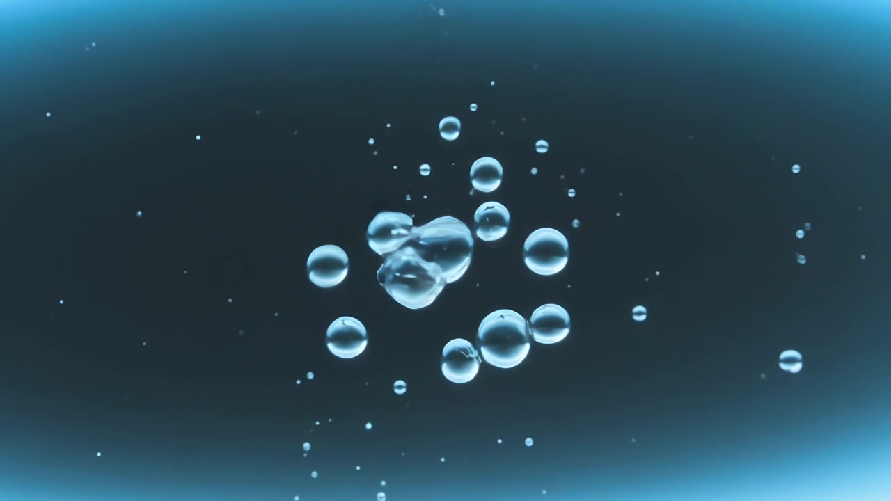Forming cluster of clear bubbles drifting inward in backlit tank, merging into single large sphere
