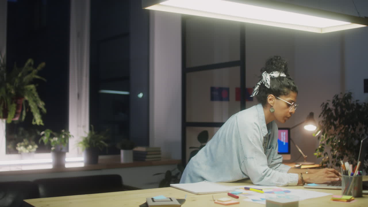 Latin Businesswoman Working Late in Office