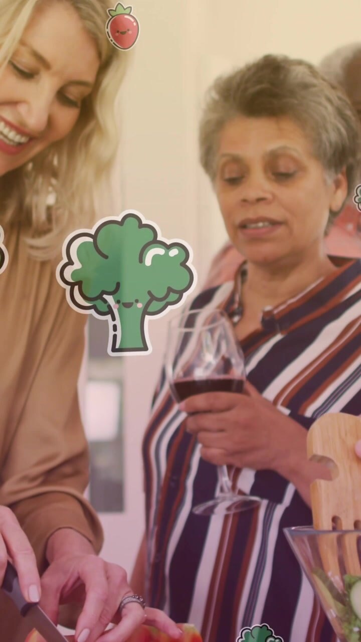 Animation of vegetables icons over diverse group of seniors cooking