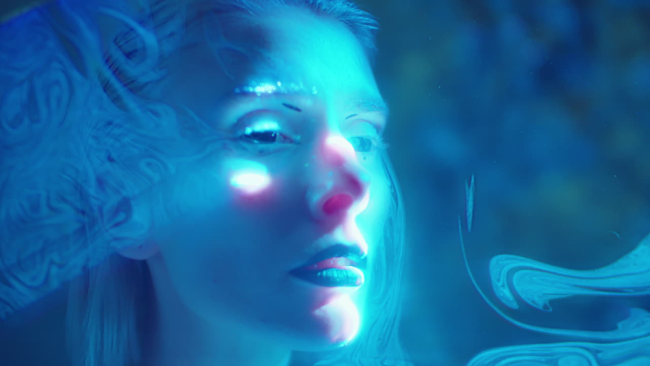 Fashion Model Posing in Liquid Sky Laser Light