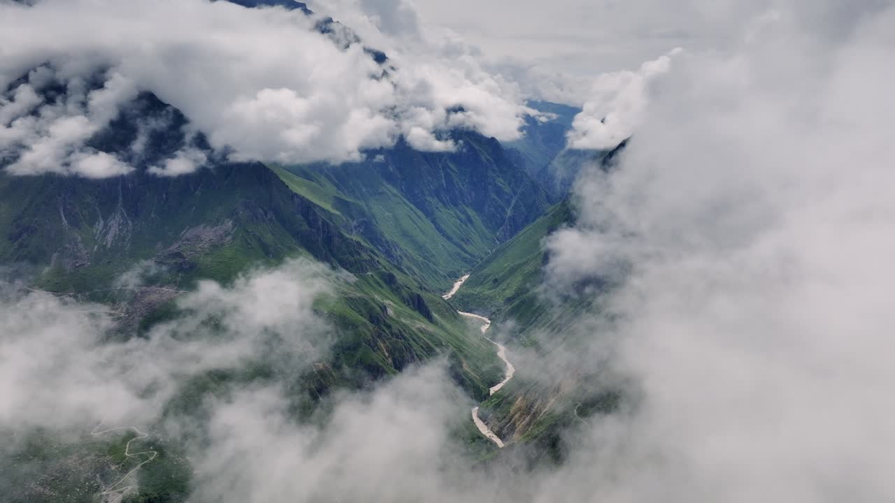 Aerial shot in reverse, with the drone pulling back to reveal the majestic Colca Valley, as clouds slowly part to expose its vast beauty.