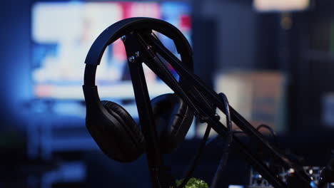 panning shot of over the ear headphones in professional studio