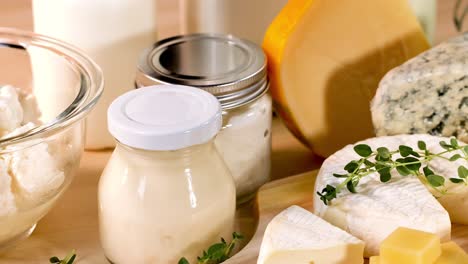 various dairy products arranged on a wooden surface