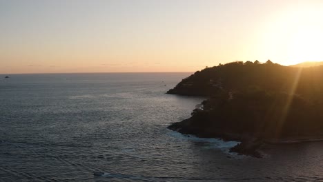 beautiful view of a sunset on the beaches of zihuatanejo shot with drone