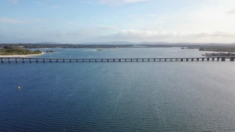 drone flying toward forster tuncurry bridge