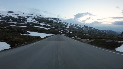 A-scenic-drive-through-the-Norwegian-countryside-following-another-vehicle