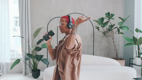 young energetic african american woman sings using phone instead microphone