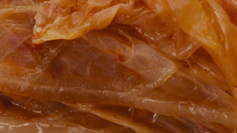 close-up of texture fermented spicy cabbage kimchi with in can. preservation of vegetables in glass jars. fermentation preserved kimchi cabbage with spices macro. asian cuisine.
