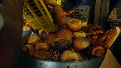 male chef putting bread in basket 4k