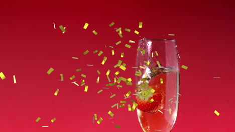 Animation-of-confetti-falling-over-champagne-glass