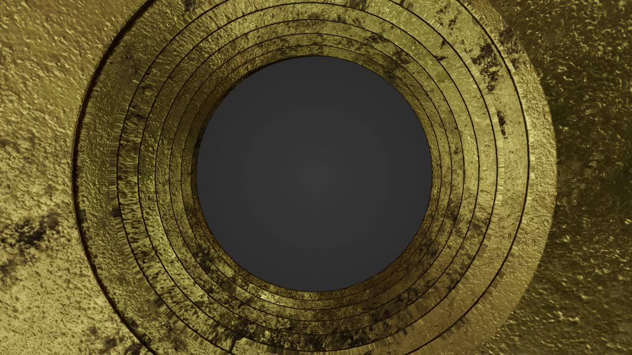 oro giratorio y nuez oxidada sobre un fondo oscuro.