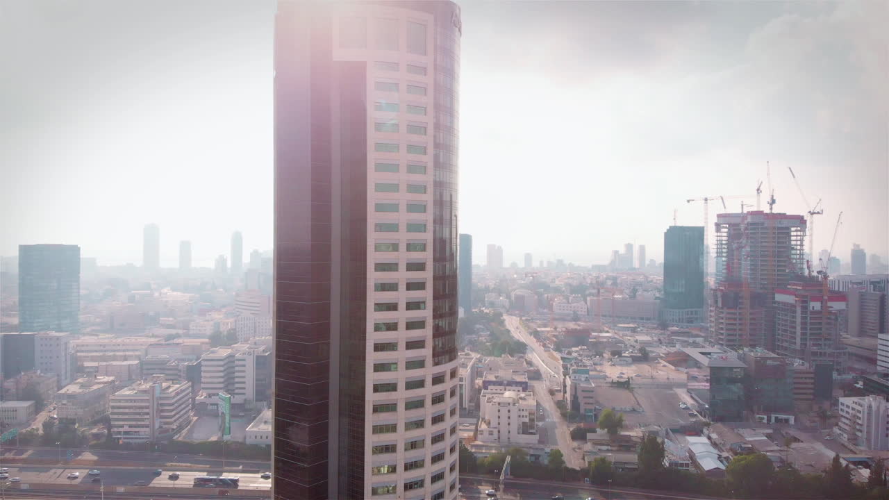 Aerial footage of Skyscraper and polluted city