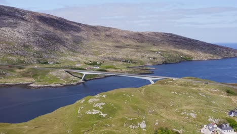 ascending drone shot of the bridge connecting scalpay to the isle of harris, part of the outer hebrides of scotland