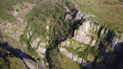 tilt down aerial view over limestone valley of cheddar gorge